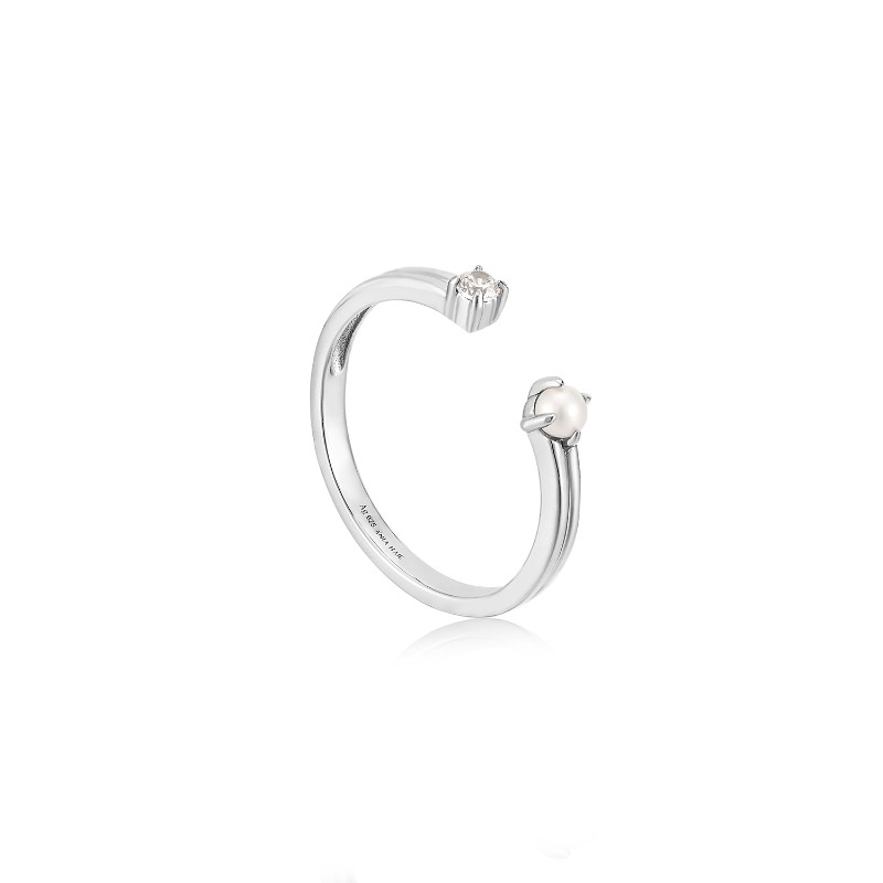 Pearl Sparkle Adjustable Ring?Add a touch of pearlescent sparkle to your unique ring stack with this stunning open-front band ring. The chic double band is finished with a mini pearl and cubic zirconia stone set on shiny rhodium plated sterling silver. Ad